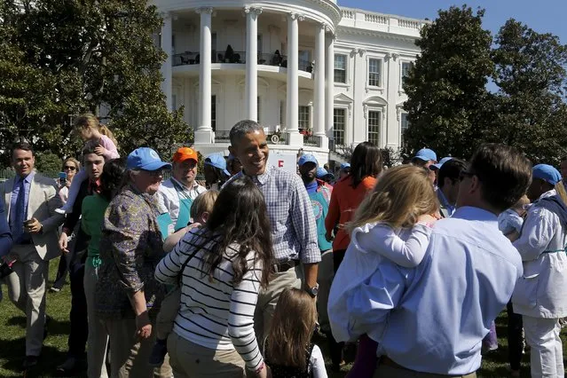U.S. President Barack Obama (C) greets children and volunteers during the annual Easter Egg Roll at the White House in Washington April 6, 2015. (Photo by Jonathan Ernst/Reuters)