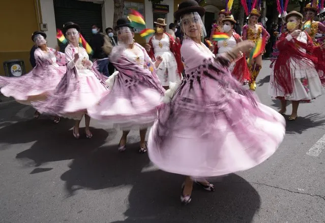 Dancers perform to celebrate the National Day of the Morenada Dance in La Paz, Bolivia, Tuesday, September 7, 2021. La Morenada is a folk dance from the Andes that was inspired by slaves brought to the region during the colonial era. (Photo by Juan Karita/AP Photo)