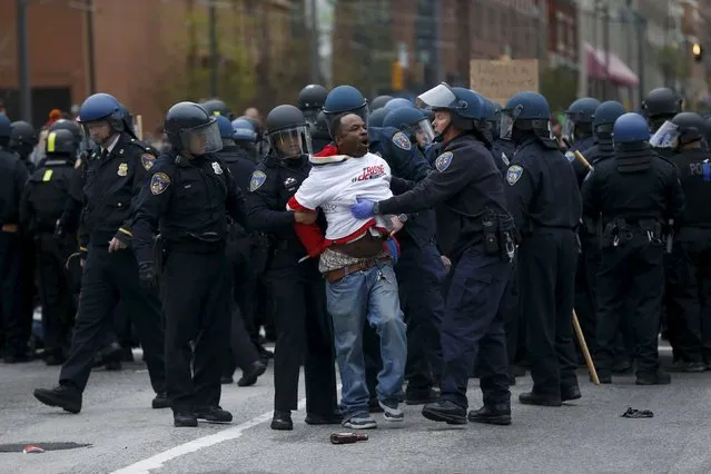 Police detain a protester at a rally to protest the death of Freddie Gray who died following an arrest in Baltimore, Maryland April 25, 2015. (Photo by Shannon Stapleton/Reuters)