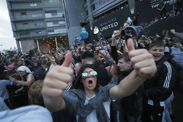 Fans react outside the stadium after Newcastle United announced takeover in Newcastle, Britain on October 7, 2021. (Photo by Lee Smith/Action Images via Reuters)