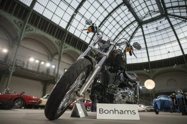 A 2013 Harley Davidson Dyna Super Glide motorcycle, which had been gifted to Pope Francis by the brand as Harley Davidson celebrated its 110th anniversary, is displayed during a press preview before a mass auction of vintage vehicles organised by Bonhams auction house as part of “Retromobile Week” at the Grand Palais in Paris, France, 05 February 2014. (Photo by Ian Langsdon/EPA)