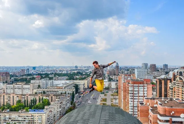 One of Yaroslav Segeda's friends on top of a tall building in Kiev. (Photo by Yaroslav Segeda/Solent News)
