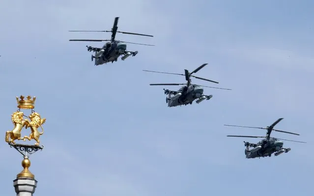 Ka-52 military helicopters fly in formation during the Victory Day parade above Red Square in Moscow, Russia, May 9, 2015. (Photo by Grigory Dukor/Reuters)