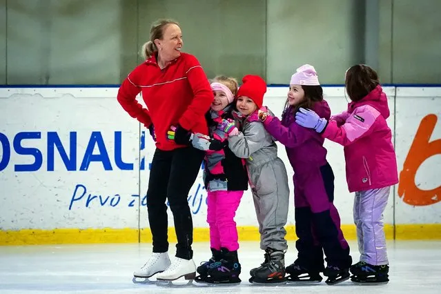 Jayne Torvill, the British ice skater, with children from the Zetra Skating Club in Sarajevo on February 13, 2024. Torvill and Christopher Dean have visited Bosnia and Herzegovina to mark 40 years since they won gold at the 1984 Winter Olympics. (Photo by Victoria Jones/PA Wire Press Association)