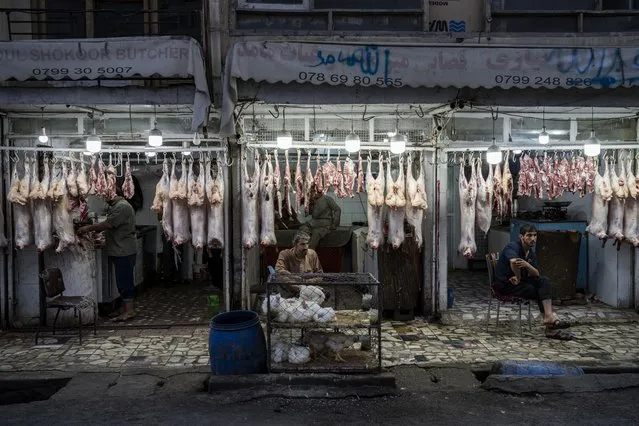 Butchers wait for customers in Kabul, Afghanistan, Monday, September 20, 2021. (Photo by Bernat Armangue/AP Photo)