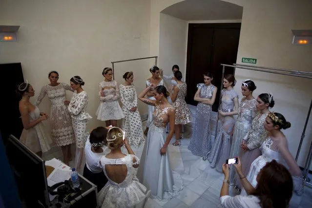 Models wearing creations by Alejandro Postigo wait backstage during “SIQ, Sevilla Handcraft and Fashion” in the Andalusian capital of Seville, southern Spain May 14, 2015. (Photo by Marcelo del Pozo/Reuters)