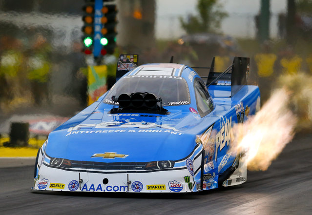 Funny Car driver John Force tears down the track during the second run of the 2015 NHRA Kansas Nationals, Friday May 22, 2015, at Heartland Park in Topeka, Kan. (Photo by Chris Neal/The Topeka Capital-Journal via AP Photo)