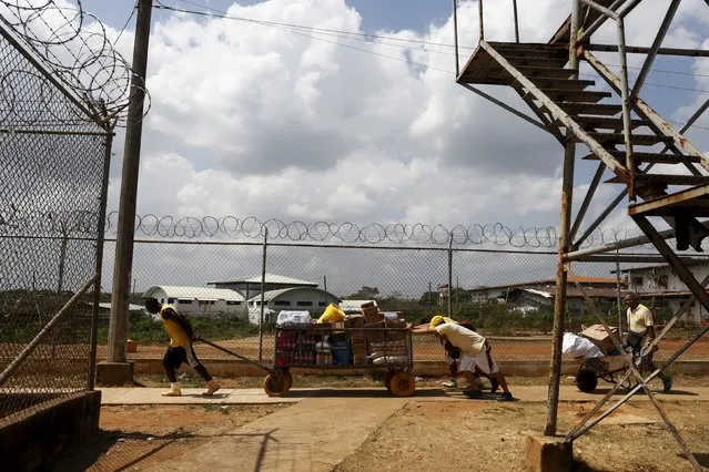 Inmates push food supplies inside La Joya prison on the outskirts of Panama City, Panama January 27, 2016. Inmates of La Joya prison on the outskirts of Panama City are housed in makeshift cells amid heavy overcrowding, living in grimy conditions and with limited medical attention. Many prisoners in the Central American nation languish for years without being sentenced. (Photo by Carlos Jasso/Reuters)
