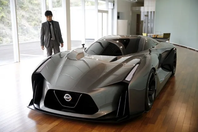 Tsutomu Yamaguchi, General Manager of Color Design Department, Global Design Center, stands next to Nissan Concept 2020 Vision Gran Turismo at the company's Global Design Center in Atsugi, Japan, April 14, 2016. (Photo by Toru Hanai/Reuters)