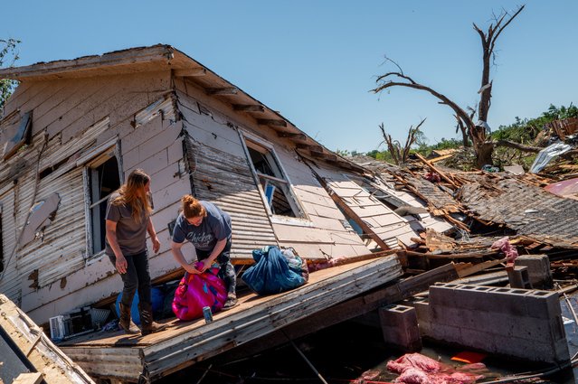 The Crowder family sift through and recover lost items after their home was struck by a tornado on May 07, 2024 in Barnsdall, Oklahoma. Barnsdall, a small town with a population of approximately 1,000 people, was struck last night by an EF3 tornado. This latest destruction comes just one week after Oklahoma has been hit with a slew of deadly tornados. (Photo by Brandon Bell/Getty Images)