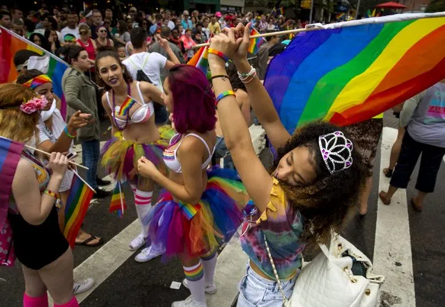 People take part in the annual NYC Gay Pride parade in New York City June 28, 2015. (Photo by Eric Thayer/Reuters)