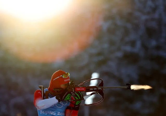 An athlete shoots during training for men's biathlon 4x7.5km relay at the National Biathlon Center in Zhangjiakou, China, at the 2022 Beijing Olympics on February 14, 2022. (Photo by Athit Perawongmetha/Reuters)