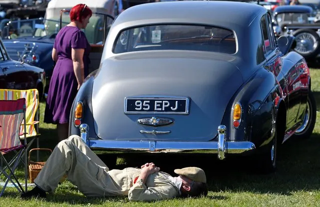Motoring enthusiasts attend the Goodwood Revival, a three day classic car racing festival celebrating the mid-twentieth century heyday of the sport, at Goodwood in southern Britain, September 13, 2019. (Photo by Toby Melville/Reuters)