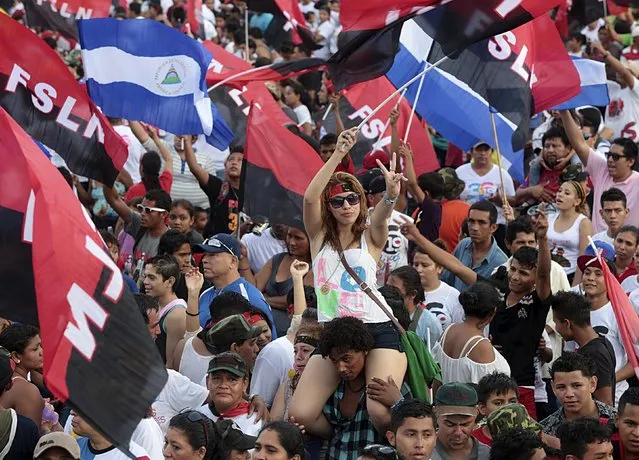 A supporter of Nicaragua's President Daniel Ortega takes part in celebrations to mark the 36th anniversary of the Sandinista Revolution at Juan Pablo II Square in Managua, Nicaragua July 19, 2015. (Photo by Oswaldo Rivas/Reuters)
