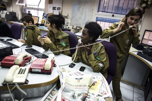Israeli soldiers from Galei Tzahal, the Israeli army radio station, work in the newsroom at the station's studios in Jaffa, south of central Tel Aviv November 10, 2013. (Photo by Nir Elias/Reuters)