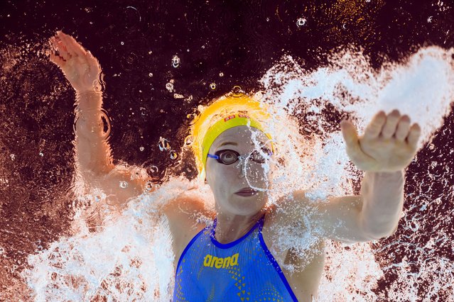 An underwater view shows Sweden's Sarah Sjoestroem competing in a heat of the women's 100m freestyle swimming event during the Paris 2024 Olympic Games at the Paris La Defense Arena in Nanterre, west of Paris, on July 30, 2024. (Photo by Oli Scarff/AFP Photo)