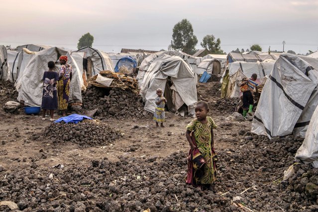 Families displaced by ongoing fighting gather at refugee camp on the outskirts of Goma, Democratic Republic of the Congo, July 11, 2024. (Photo by Moses Sawasawa/AP Photo)