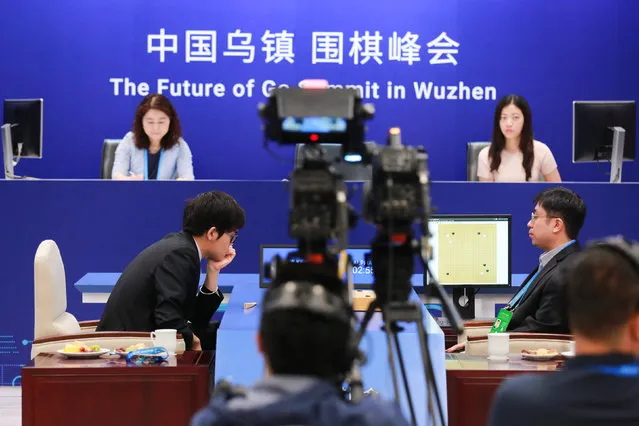 Chinese Go player Ke Jie reacts during his second match against Google's artificial intelligence program AlphaGo at the Future of Go Summit in Wuzhen, Zhejiang province, China May 25, 2017. (Photo by Reuters/Stringer)