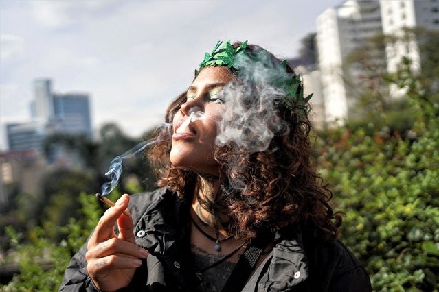 A person takes part in a demonstration to demand the decriminalisation of cannabis, in Sao Paulo, Brazil on June 17, 2023. (Photo by Mariana Greif/Reuters)