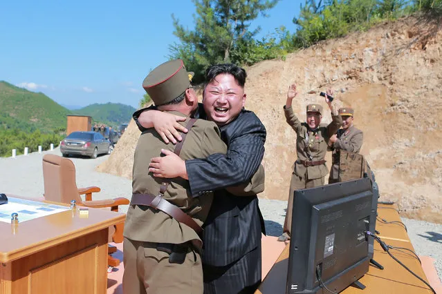 North Korean leader Kim Jong Un reacts with scientists and technicians of the DPRK Academy of Defence Science after the test-launch of the intercontinental ballistic missile Hwasong-14 in this undated photo released by North Korea's Korean Central News Agency (KCNA) in Pyongyang July, 5, 2017. (Photo by Reuters/KCNA)
