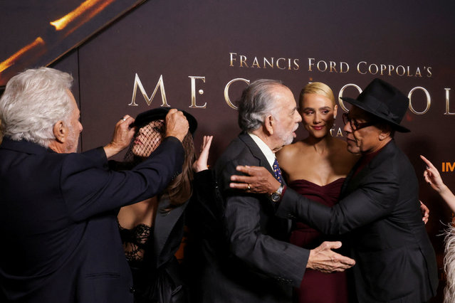 Cast members prepare for a group photo at the screening of the film “Megalopolis” at AMC Lincoln Square in New York City on September 24, 2024. (Photo by Kent J Edwards/Reuters)