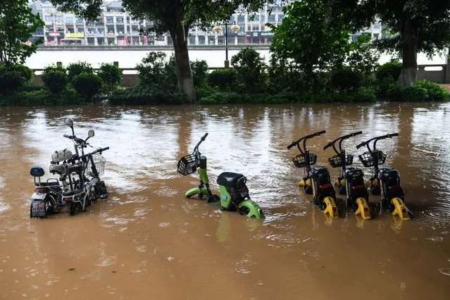This picture shows a flooded street after heavy rains in Shaoguan in China's southern Guangdong province on June 21, 2022. (Photo by AFP Photo/China Stringer Network)