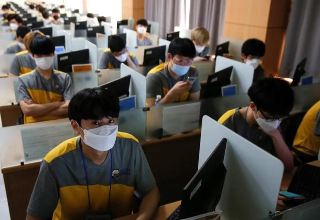 South Korean young men wear masks to protect against the new coronavirus as they take part in a conscription examination for the national service in Seoul, South Korea, February 3, 2020. (Photo by Heo Ran/Reuters)