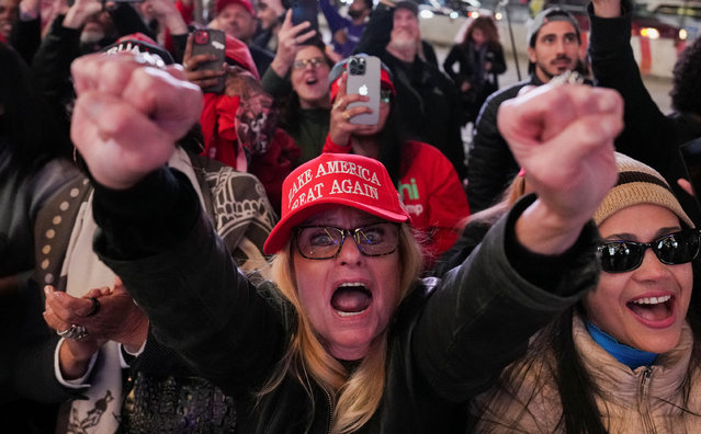 Supporters cheer as they watch a live transmission on a screen during a rally for Donald Trump, outside Madison Square Garden in New York on October 27, 2024. (Photo by David Dee Delgado/Reuters)