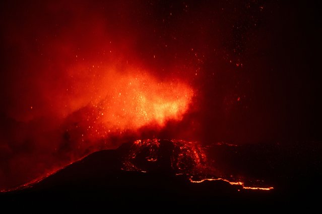 Lava flows from the Mount Etna volcano on the southern Italian island of Sicily near Catania on August 15, 2014. (Photo by Marco Restivo/Etna Walk via Reuters)