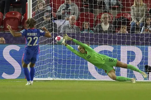 Netherlands' goalkeeper Daphne van Domselaar fails to stop a penalty kick from France's Eve Perisset, left, to open the score during the Women Euro 2022 quarterfinals soccer match between France and the Netherlands at the New York Stadium in Rotherham, England, Saturday, July 23, 2022. (Photo by Jon Super/AP Photo)