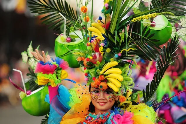 A model wears a chemistry inspired costume in the kids carnival during The 13th Jember Fashion Carnival 2014 on August 21, 2014 in Jember, Indonesia. (Photo by Robertus Pudyanto/Getty Images)