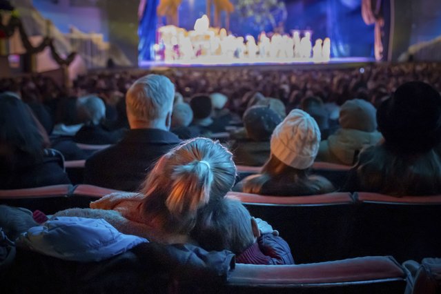 People watch the Christmas Spectacular Starring the Radio City Rockettes at Radio City Music Hall, Friday, December 13, 2024, in New York. (Photo by Julia Demaree Nikhinson/AP Photo)