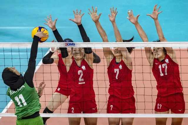Mahsa Kadkhoda #11 of Team Iran spikes the ball during their semi-final round match against Team Chinese Taipei on day seven of the AVC Cup For Women at PhilSports Arena on August 28, 2022 in Pasig, Philippines. (Photo by Ezra Acayan/Getty Images)
