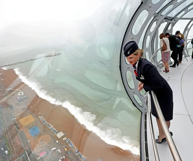 British Airways Global Ambassador Tina Burton looks out of the new British Airways i360 tower in Brighton, southeast England, as the “vertical pier in the sky” is set to give tourists a new view of Brighton's historic seafront Tuesday August 2, 2016. Standing at 531ft (156 metres) tall, the viewing tower affords panoramic views of up to 26 miles of the surrounding south coast and will open its doors to visitors this week. (Photo by Steve Parsons/PA Wire via AP Photo)