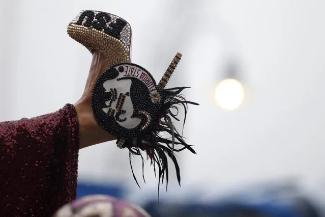 Miss Florida Victoria Cowen displays her shoe during the Miss America Shoe Parade at the Atlantic City boardwalk, Saturday, September 13, 2014, in Atlantic City, N.J. (Photo by Julio Cortez/AP Photo)