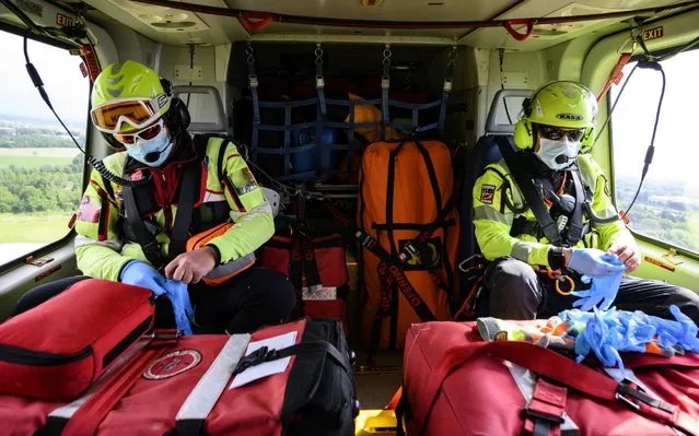 The mountain rescue medical personnel in the rescue helicopter during an operation on June 10, 2020 in Turin, Italy. The whole country is returning to normality after more than two months of a nationwide lockdown meant to curb the spread of Covid-19. (Photo by Diego Puletto/Getty Images)