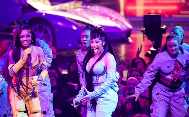 American rappers Cardi B (C) and GloRilla perform during the 2022 American Music Awards, at the Microsoft Theater in Los Angeles, California, U.S., November 20, 2022. (Photo by Mario Anzuoni/Reuters)