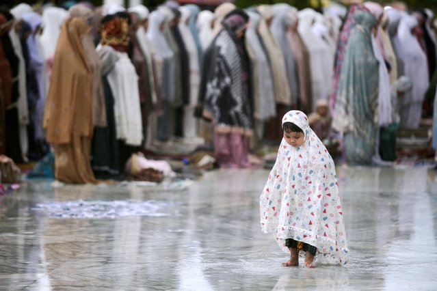 A girl attends mass prayers at Baiturrahman mosque during Eid al-Fitr, in Banda Aceh, Indonesia, on March 31, 2025. (Photo by Riska Munawarah/Reuters)