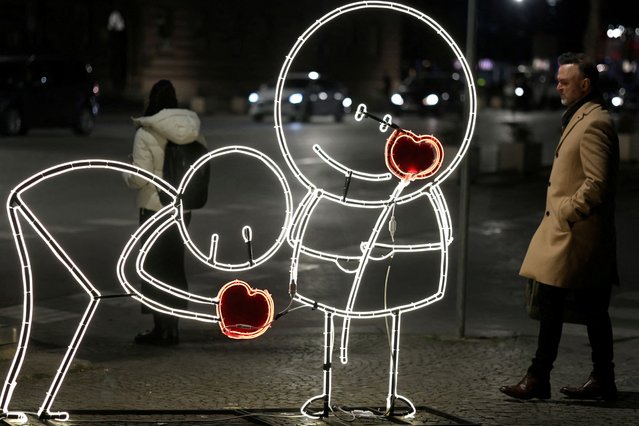 People pass by a light decoration during Valentine’s Day in Tirana, Albania, on February 14, 2024. (Photo by Florion Goga/Reuters)