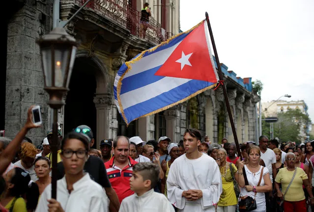 People participate in the annual procession of Our Lady of Charity, the patron saint of Cuba, in Old Havana, Cuba, September 8, 2016. (Photo by Enrique De La Osa/Reuters)