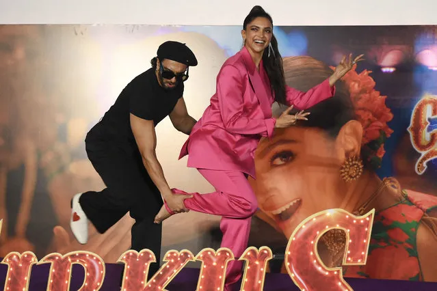 Bollywood actors Ranveer Singh and Deepika Padukone pose for pictures during the song launch of their upcoming Indian Hindi-language period comedy film “Cirkus” in Mumbai on December 8, 2022. (Photo by Sujit Jaiswal/AFP Photo)