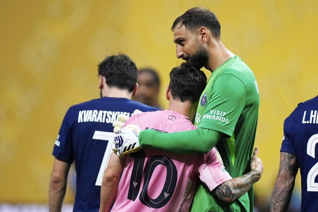 Paris Saint-Germain's goalkeeper Gianluigi Donnarumma embraces Inter Miami's Lionel Messi after the Club World Cup round of 16 soccer match between PSG and Inter Miami in Atlanta, Sunday, June 29, 2025. (Photo by Mike Stewart/AP Photo)