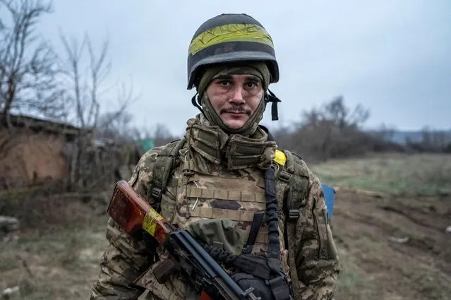 A serviceman of the Carpathian Sich Battalion is seen at his position on a frontline, as Russia's attack on Ukraine continues, near the town of Lyman, Donetsk region, Ukraine on December 8, 2022. (Photo by Viacheslav Ratynskyi/Reuters)