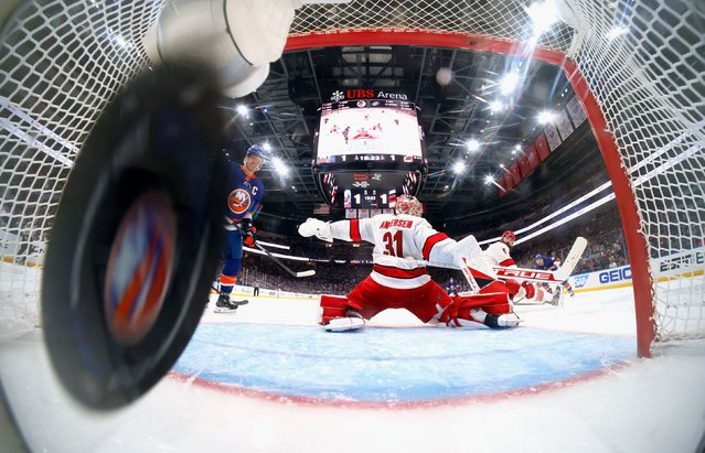 The puck gets by Carolina goaltender Frederik Andersen during the third period of NHL playoff game against the New York Islanders on Saturday, April 27, 2024. The Islanders went on to win this game in double overtime, but it was their only win of the series as Carolina advanced to the second round. (Photo by Bruce Bennett/Getty Images)