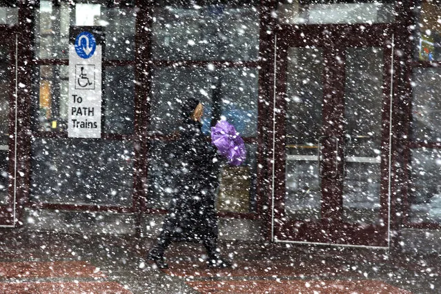 People enters the PATH station during a snow storm on March 21, 2018 in Jersey City, New Jersey. At least 12 to 15 inches are expected in parts of Westchester, New York, New Jersey and Long Island as the area sees it's fourth nor'easter in recent weeks. (Photo by Eduardo Munoz Alvarez/Getty Images)