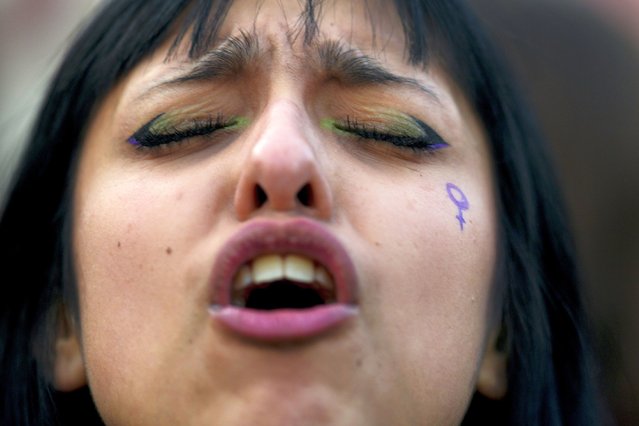 A woman participates in a march marking the ninth anniversary of the “Ni Una Menos”, or Not One Less, women's movement in Buenos Aires, Argentina, Monday, June 3, 2024. (Photo by Natacha Pisarenko/AP Photo)