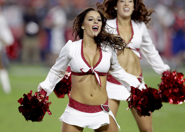 An Arizona Cardinals cheerleader performs during the first half of an NFL preseason football game against the Denver Broncos, Thursday, September 1, 2016, in Glendale, Ariz. (Photo by Rick Scuteri/AP Photo)