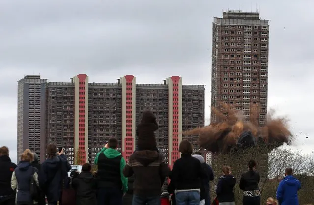 The demolition by use of controlled explosives of the Red Road block of flats in Glasgow, on May 5, 2013. (Photo by David Cheskin/PA Wire)