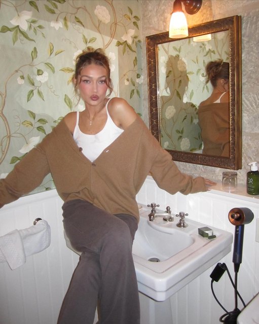 American fashion model and TV personality Gigi Hadid puckers up while lounging on a sink on November 4, 2025. (Photo by gigihadid/Instagram)