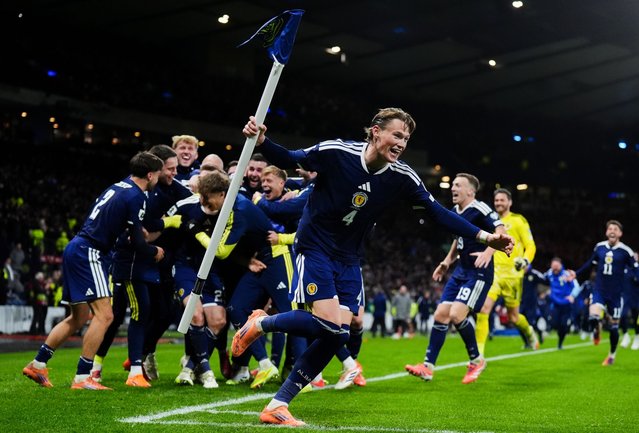Scotland's Scott McTominay celebrates with team mates after their sides fourth goal scored by Kenny McLean during the FIFA World Cup European Qualifying match at Hampden Park, Glasgow on Tuesday, November 18, 2025. (Photo by Andrew Milligan/PA Images via Getty Images)